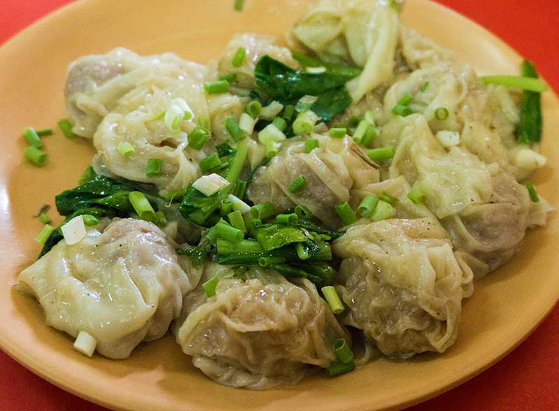 Salladslök i asiatisk mat wonton - x