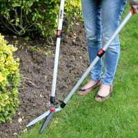 Grässax med teleskophandtag